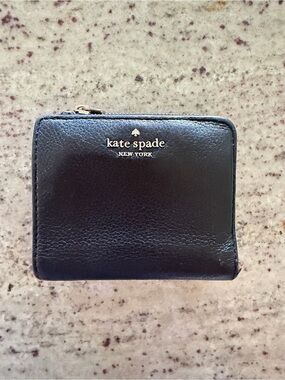kate spade black leather zip-around wallet with gold logo